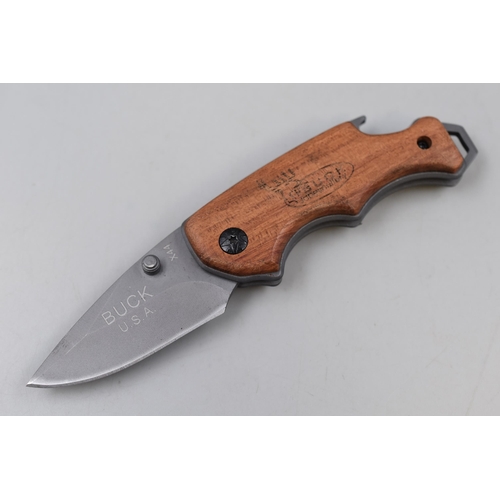 266 - A Buck X44 Wood Handled Pocket Knife