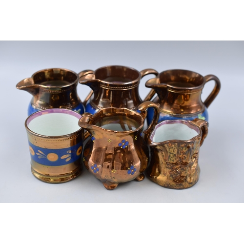 243 - Copper Lusterware 5 small jugs and 1 small cup