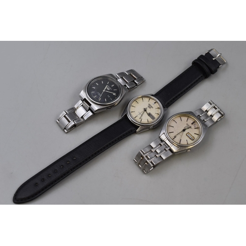 134 - Three Seiko 5 Automatic Gents Day/Date Watches (Black Dial and Two Champagne Dials), All Working