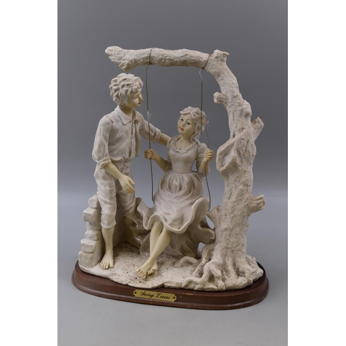 390 - Large Vintage Biscuit Porcelain Figurine entitled Swing Lovers Standing on Wooden Plinth (14