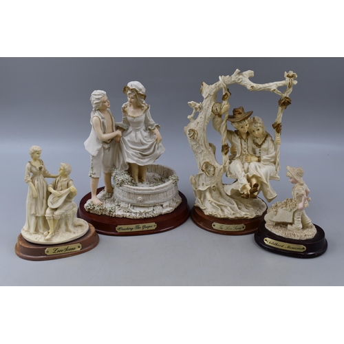 393 - Four Vintage Biscuit Ware Figurines standing on Wooden Plinths entitled Childhood Memories, Love Sce... 