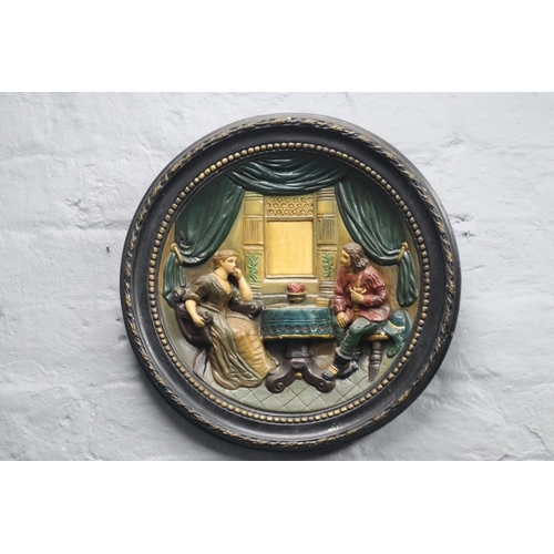 405 - Johann Maresch relief Moulded Pottery dish decorated with a 17th Century Cavalier and Lady in an Int... 