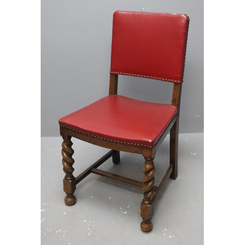 665 - Three vintage oak dinning chairs with barley sugar legs and red leather upholstery measuring 34