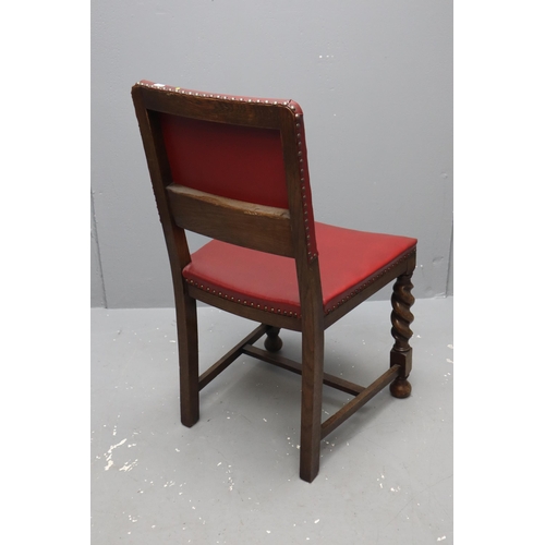 665 - Three vintage oak dinning chairs with barley sugar legs and red leather upholstery measuring 34