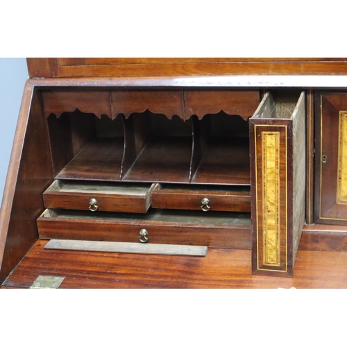 680 - Early 20th Century writing bureau in dark wood with 3 large and two small drawers with more in the d... 