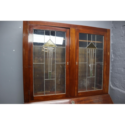 680 - Early 20th Century writing bureau in dark wood with 3 large and two small drawers with more in the d... 