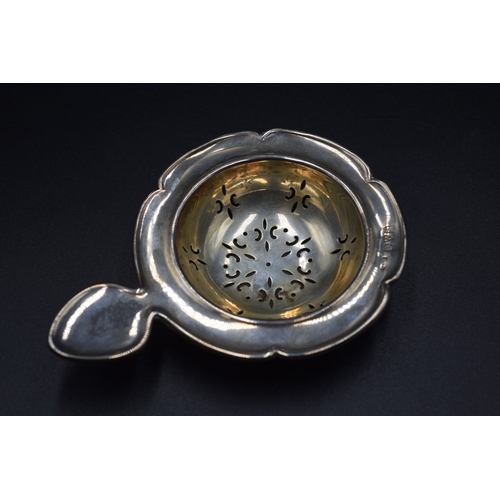 32 - A London Hallmarked Tea Strainer, circa 1970,s Maker Cooper Brothers and Sons Ltd (26 grams) and a C... 