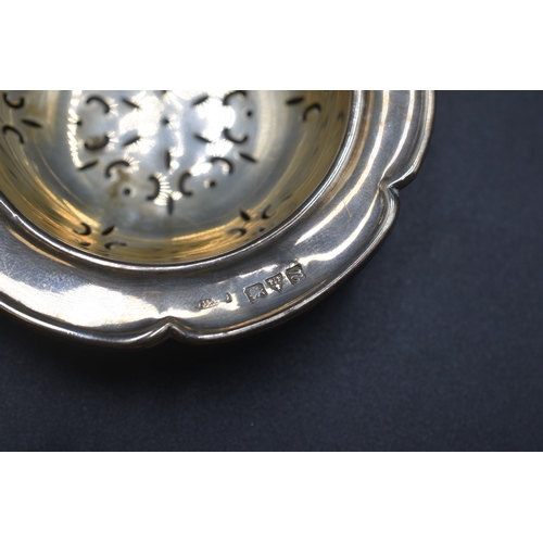 32 - A London Hallmarked Tea Strainer, circa 1970,s Maker Cooper Brothers and Sons Ltd (26 grams) and a C... 