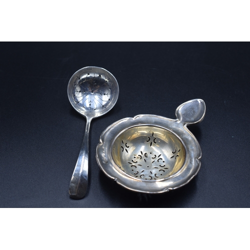 32 - A London Hallmarked Tea Strainer, circa 1970,s Maker Cooper Brothers and Sons Ltd (26 grams) and a C... 