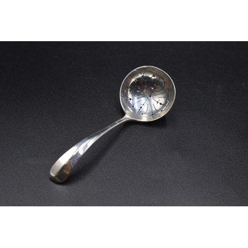 32 - A London Hallmarked Tea Strainer, circa 1970,s Maker Cooper Brothers and Sons Ltd (26 grams) and a C... 