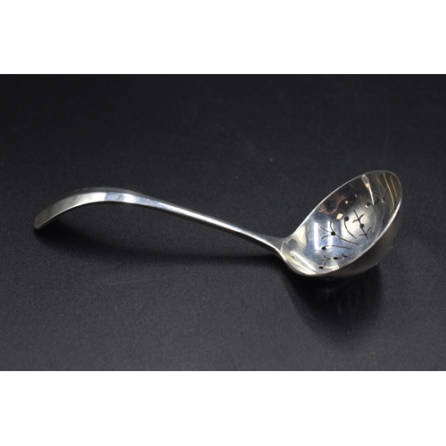 32 - A London Hallmarked Tea Strainer, circa 1970,s Maker Cooper Brothers and Sons Ltd (26 grams) and a C... 