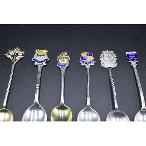 47 - Six Hallmarked Silver Souvenir Teaspoons, four with Enamelled Badges, (total weight 79 grams)