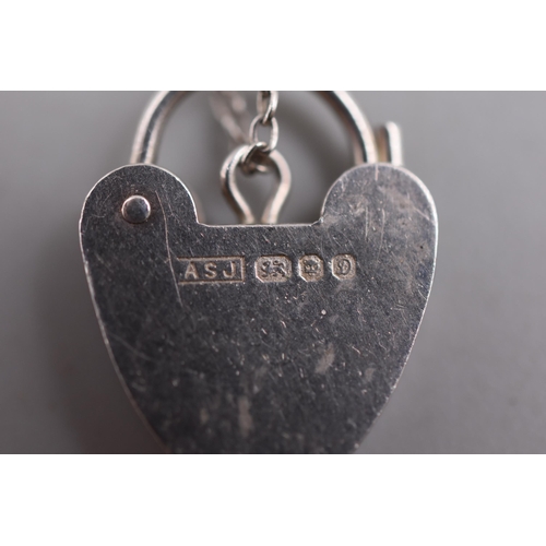 57 - A Hallmarked London Silver Padlock Charm Bracelet With Safety Chain, And Silver Glass Spinner Charm.... 