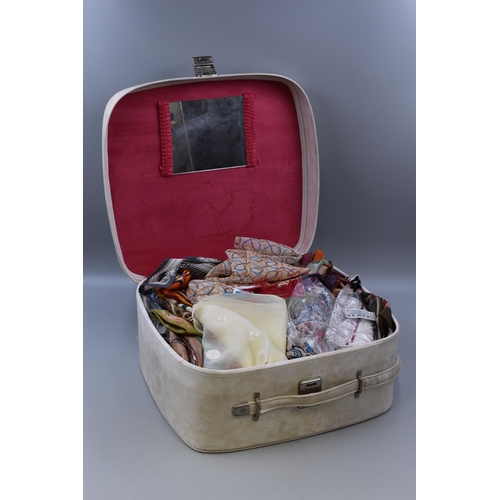 860 - Vintage suitcase containing a large quantity of mainly silk scarves