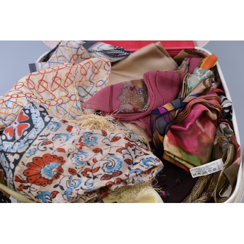 860 - Vintage suitcase containing a large quantity of mainly silk scarves