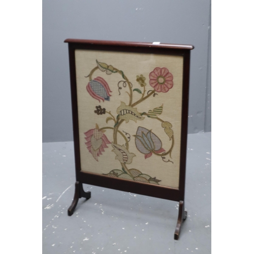 680 - A embroidered wooden fire screen (31