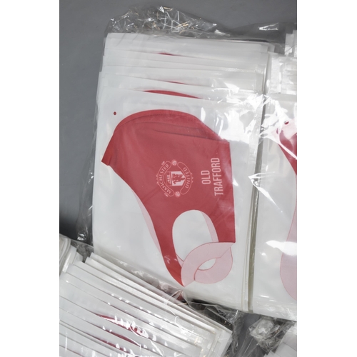 802 - A Large Selection of Manchester United Face Masks, With Four Manchester United Scarves