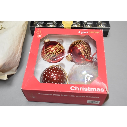 842 - A selection of Christmas decorations to include lights, glass baubles and toppers