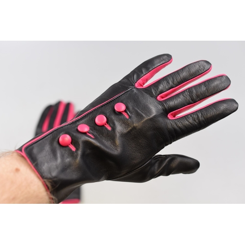 228 - Aspinal of London black leather gloves with pink buttons still in box size 8