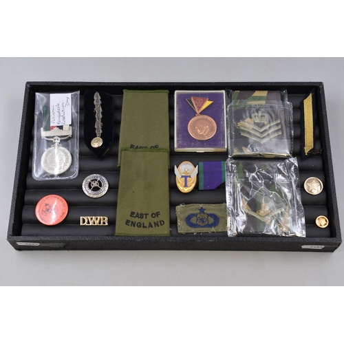 249 - Selection of Militaria including Medals, Badges, Buttons, Rank Insignia and More