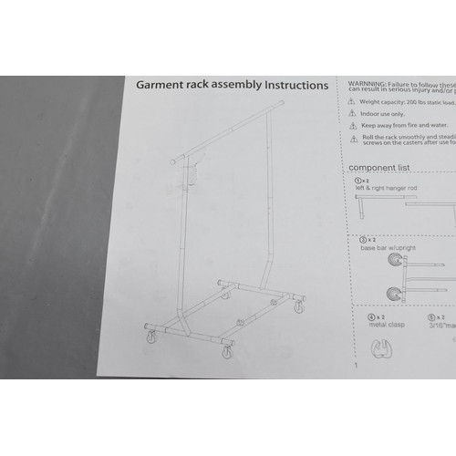 350 - An As New Chrome Clothing Rail With Castors, With Instructions. Appears Complete, Size Unknow But Bo... 