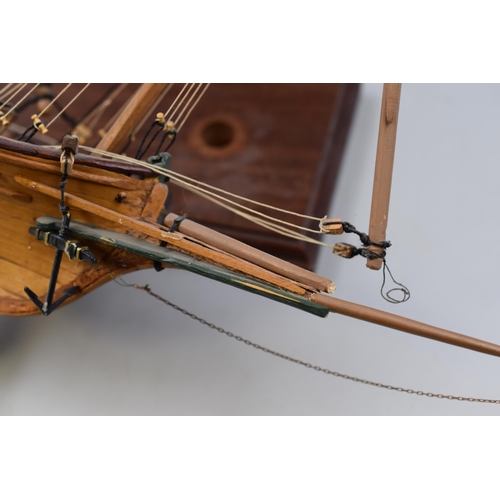 381 - Model of a three masted ship with cannon and lifeboat measuring 28