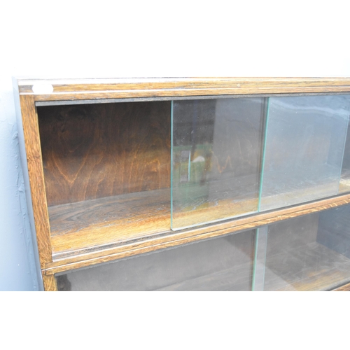 592 - Glazed oak sectional barristers bookcase/display unit (53