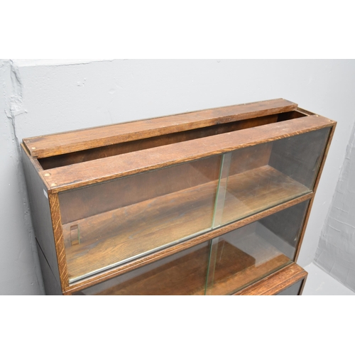 592 - Glazed oak sectional barristers bookcase/display unit (53