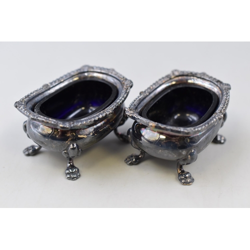 47 - A pair of vintage Silver Plate salt cellars with blue glass inserts