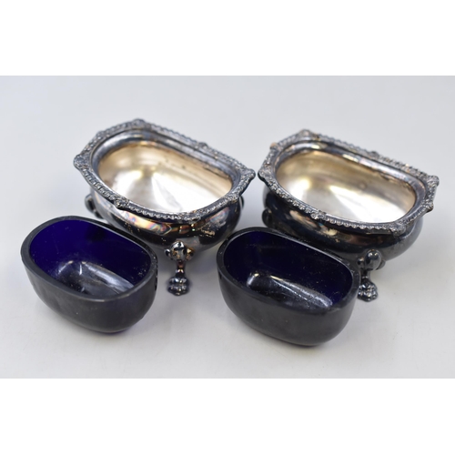 47 - A pair of vintage Silver Plate salt cellars with blue glass inserts