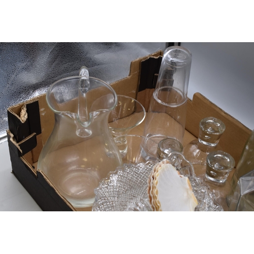 814 - Selection of glassware to include a jug, vase, cocktail glasses, decanter, fruit bowl, and more