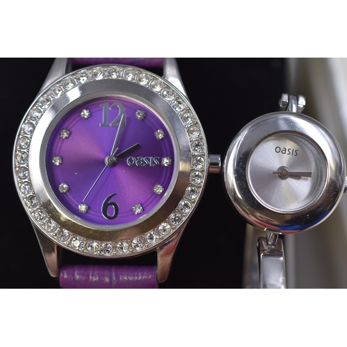 52 - Two Ladies Boxed Oasis Watches (One with Purple Strap and a Steel Strapped with interchange Bezzels