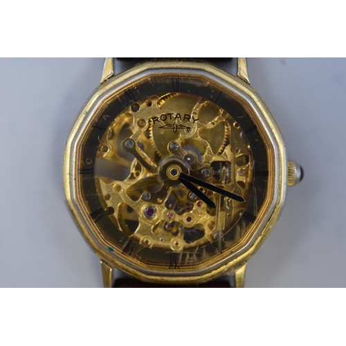 67 - A Gold Tone Rotary Mechanical Skeleton Watch, With Brown Leather Strap. Working