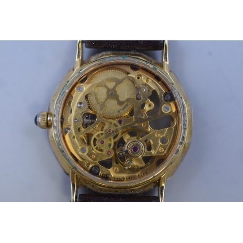 67 - A Gold Tone Rotary Mechanical Skeleton Watch, With Brown Leather Strap. Working