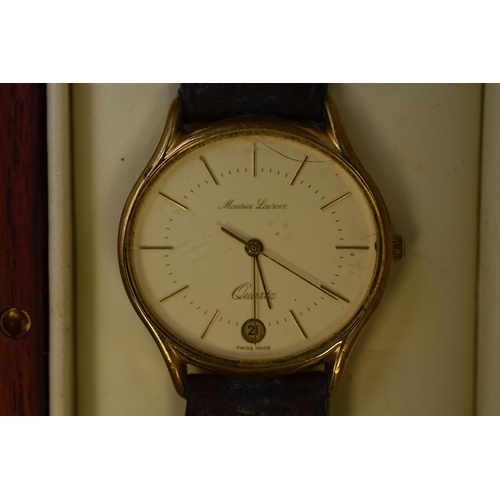 82 - A Maurice Lacroix Gold Tone Gents Day/Time Quartz Watch, With Leather Strap and Presentation Box. Sp... 