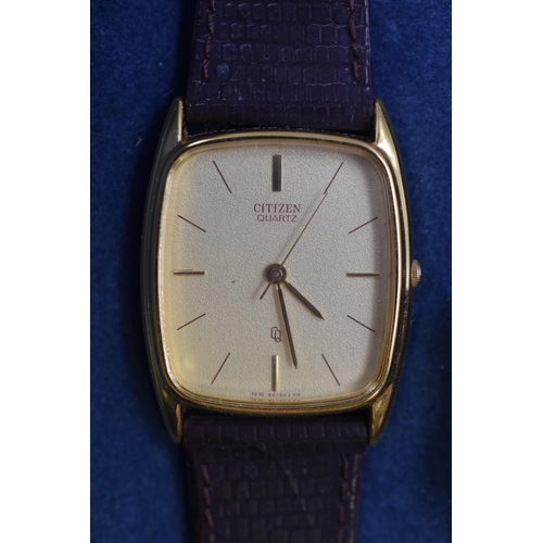 83 - A Gents Citizen Quartz Gold Tone Dial Watch With Leather Strap, In Presentation Box. Working