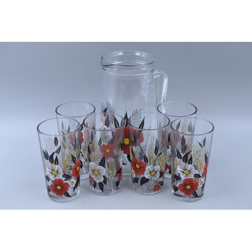 235 - 1970/80s Covetro Italian glass jug and six tumblers with flower pattern, jug measures 8