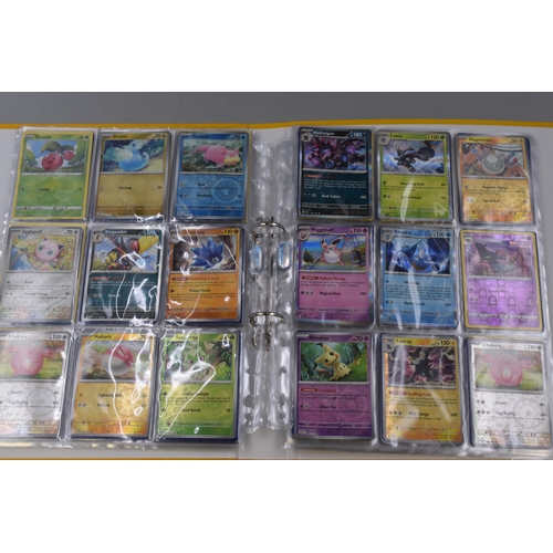 165 - Three Folders of Assorted Modern Pokemon Cards To Include Holo, Reverse Holo, And More