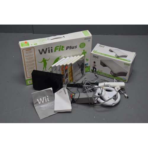 706 - Nintendo wii console black with accessories to include 3 wii remotes, 1 wheel controller holder, 1 n... 