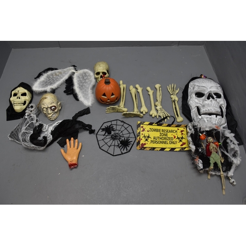 711 - Two boxes of Halloween items to include, bones, skulls, pumpkins and other props