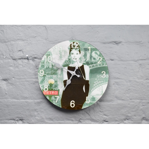 324 - Audrey Hepburn glass wall clock (working when tested)