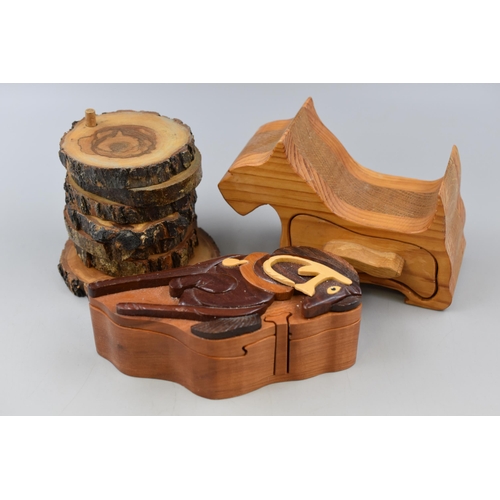 205 - Three Wooden Items To Include Natural Wood Coaster Set, Terrier Trinket Box, And Puzzle Trinket Box