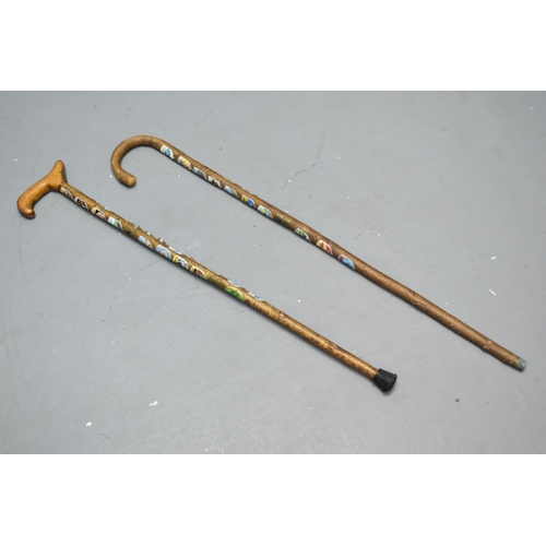 294 - Two Walking Sticks Mounted With Various Collectable Walking Stick Badges