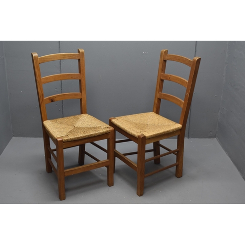 542 - A Pair of Modern Ladder Back Wicker Seated Dining Chairs. Approx 92cm Tall