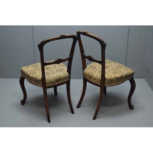 543 - A Pair of Victorian Style Walnut Dining Chairs With Carved Floral Design. Approx 87cm Tall