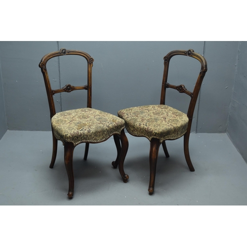 543 - A Pair of Victorian Style Walnut Dining Chairs With Carved Floral Design. Approx 87cm Tall