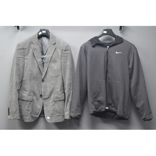 694 - Two Jackets to Include A New Paul Jones Corduroy Gents Grey Jacket (Size Small) & A Nike Reversi... 