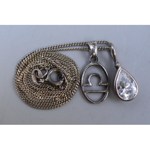 53 - A 925. Silver Necklace Chain With Two 925. Silver Pendants (Clear Stoned Teardrop, And Libra Zodiac)