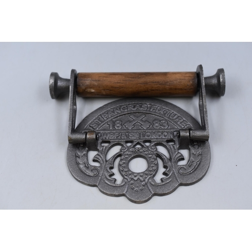 300 - A Cast Iron St Pancreas Wall Mounted Toilet Roll Holder