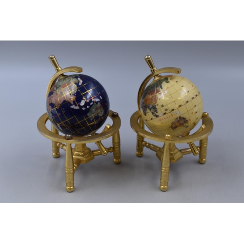 202 - Two small globes with solid brass frames standing 6